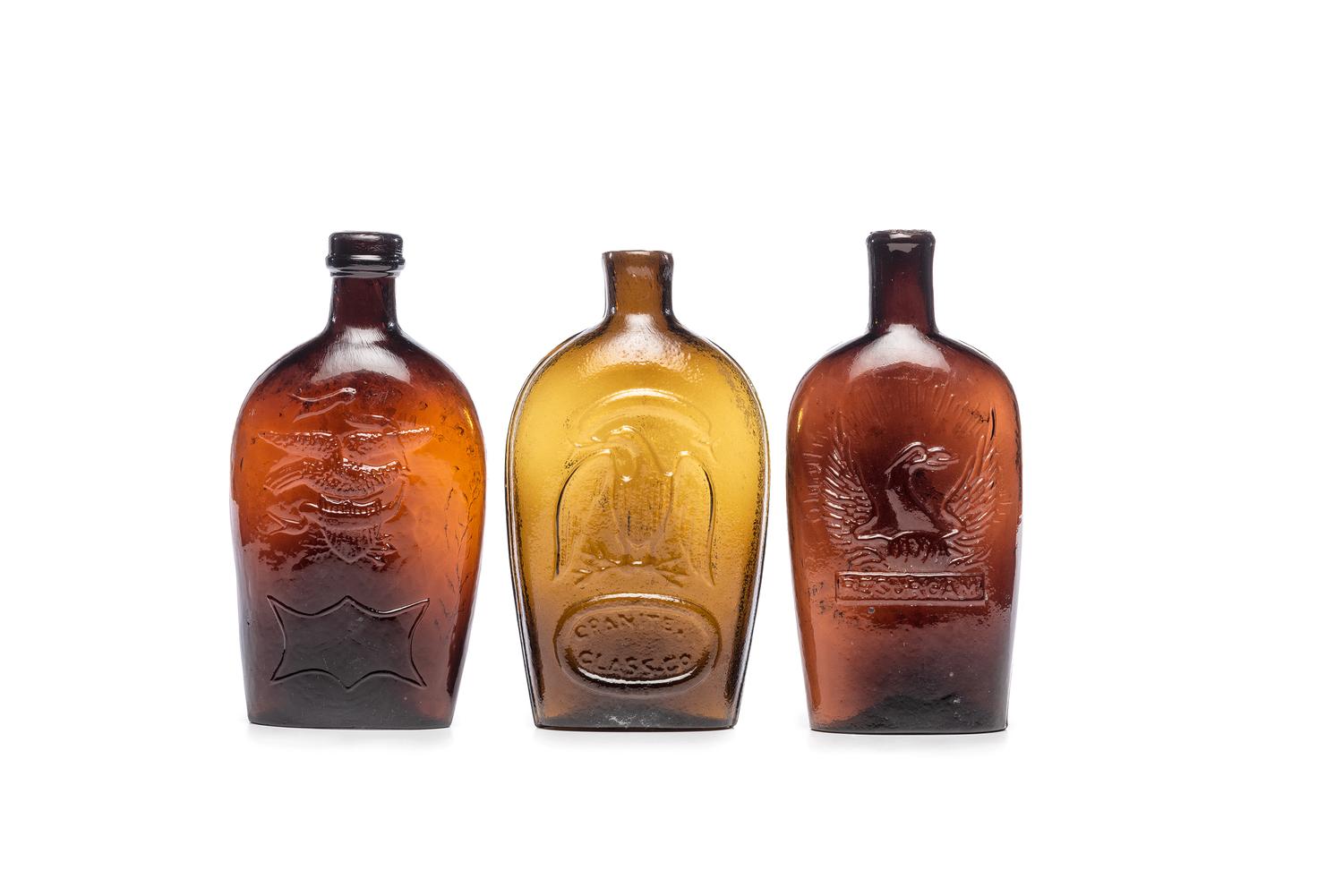 Three Molded Glass Amber Flasks