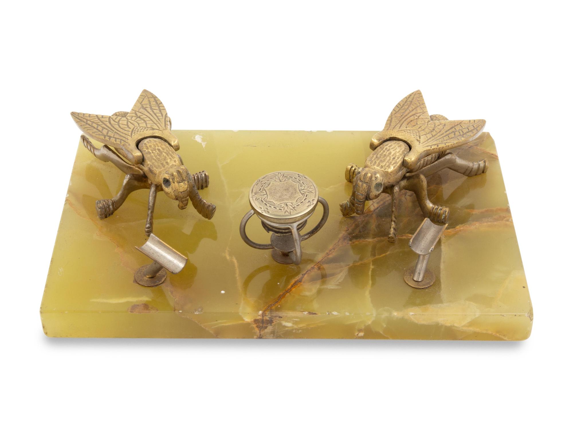 An Onyx and Brass Smoker's Stand