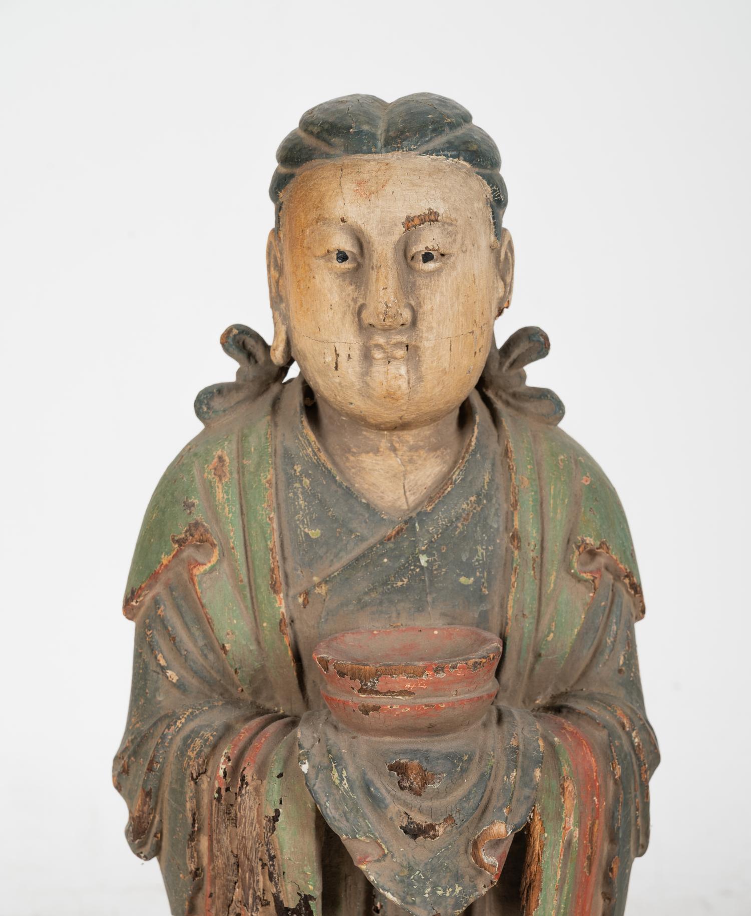 A Chinese Carved Wood Standing Figure with Polychrome Decoration