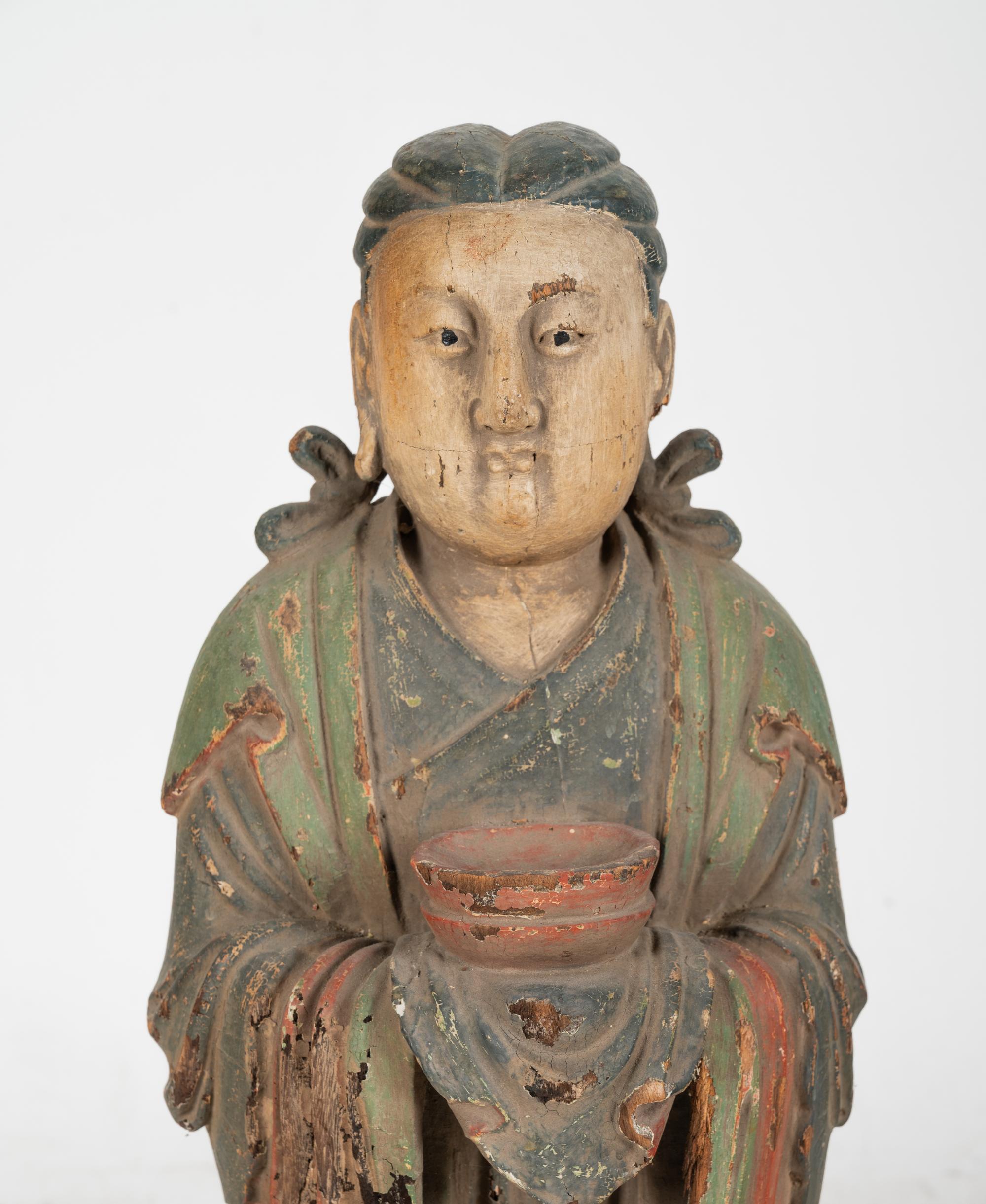 A Chinese Carved Wood Standing Figure with Polychrome Decoration