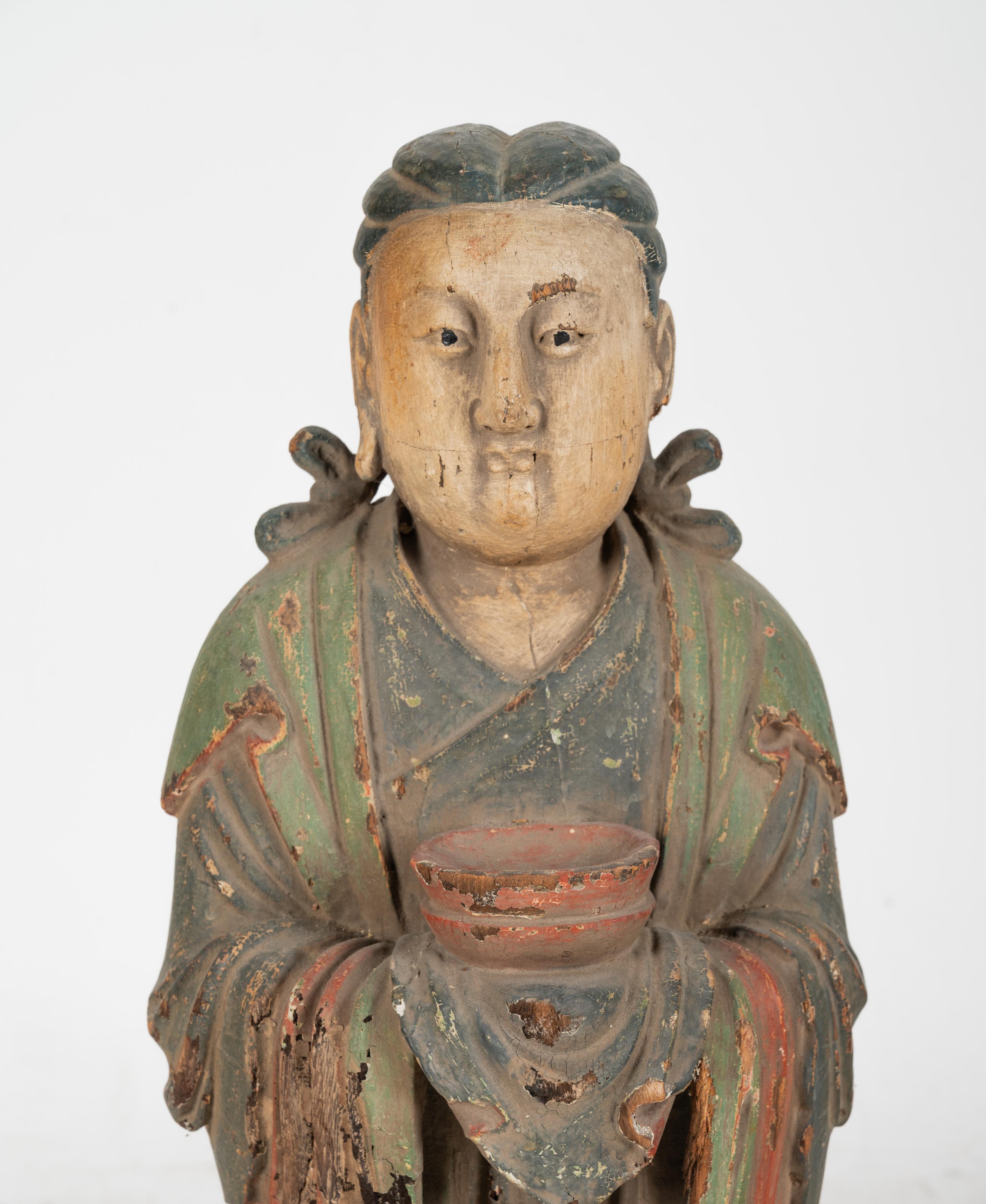 A Chinese Carved Wood Standing Figure with Polychrome Decoration