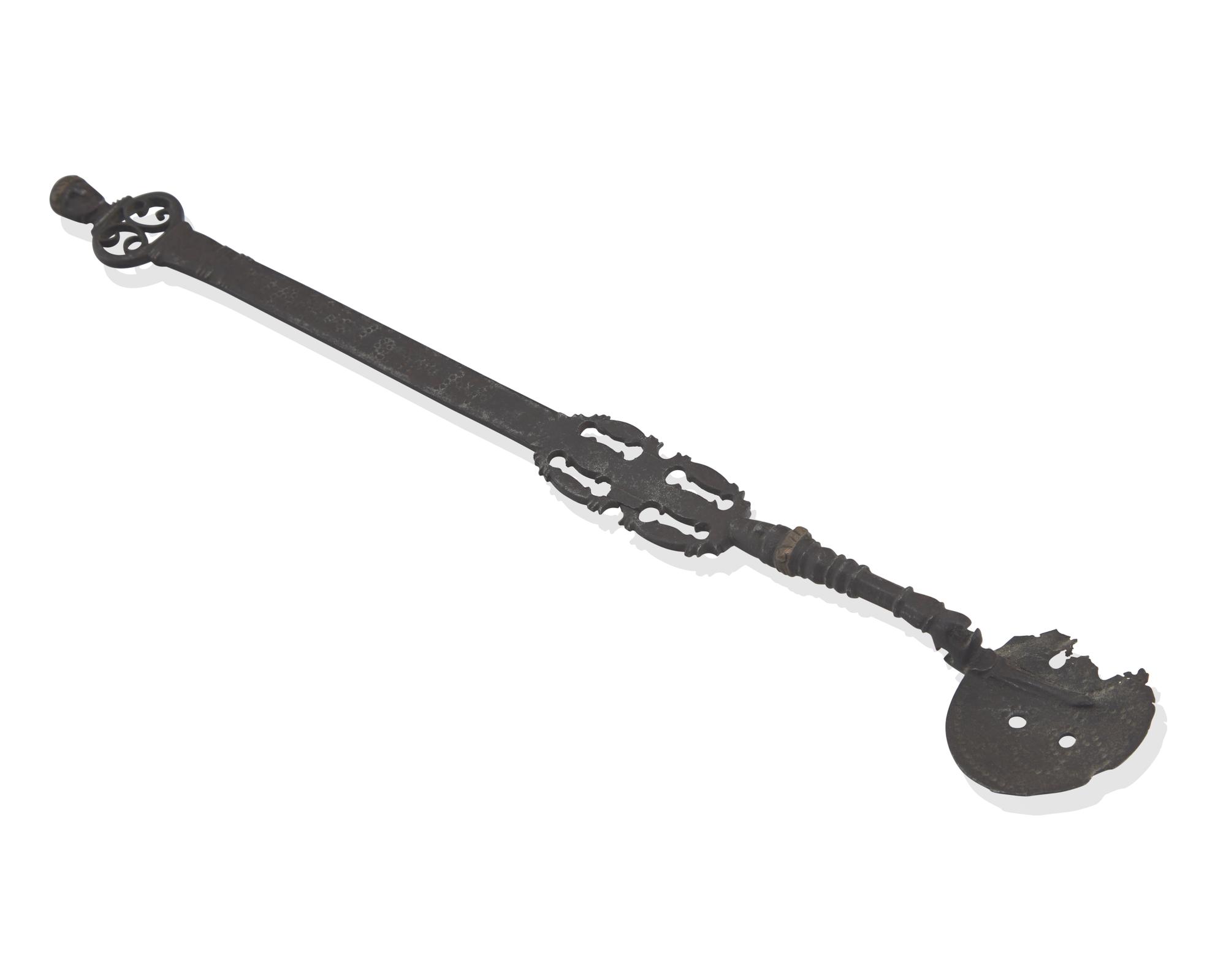 A Copper-Inlaid Wrought Iron Slotted Spoon with Human Head-Form Terminals