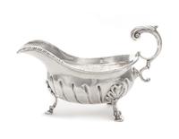 A George II Silver Sauce Boat, Robert Innes, London, 1756, with a gadrooned rim and an applied S-scroll handle, the body with impressed