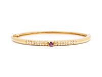 An 18 Karat Yellow Gold, Ruby and Diamond Bangle Bracelet,