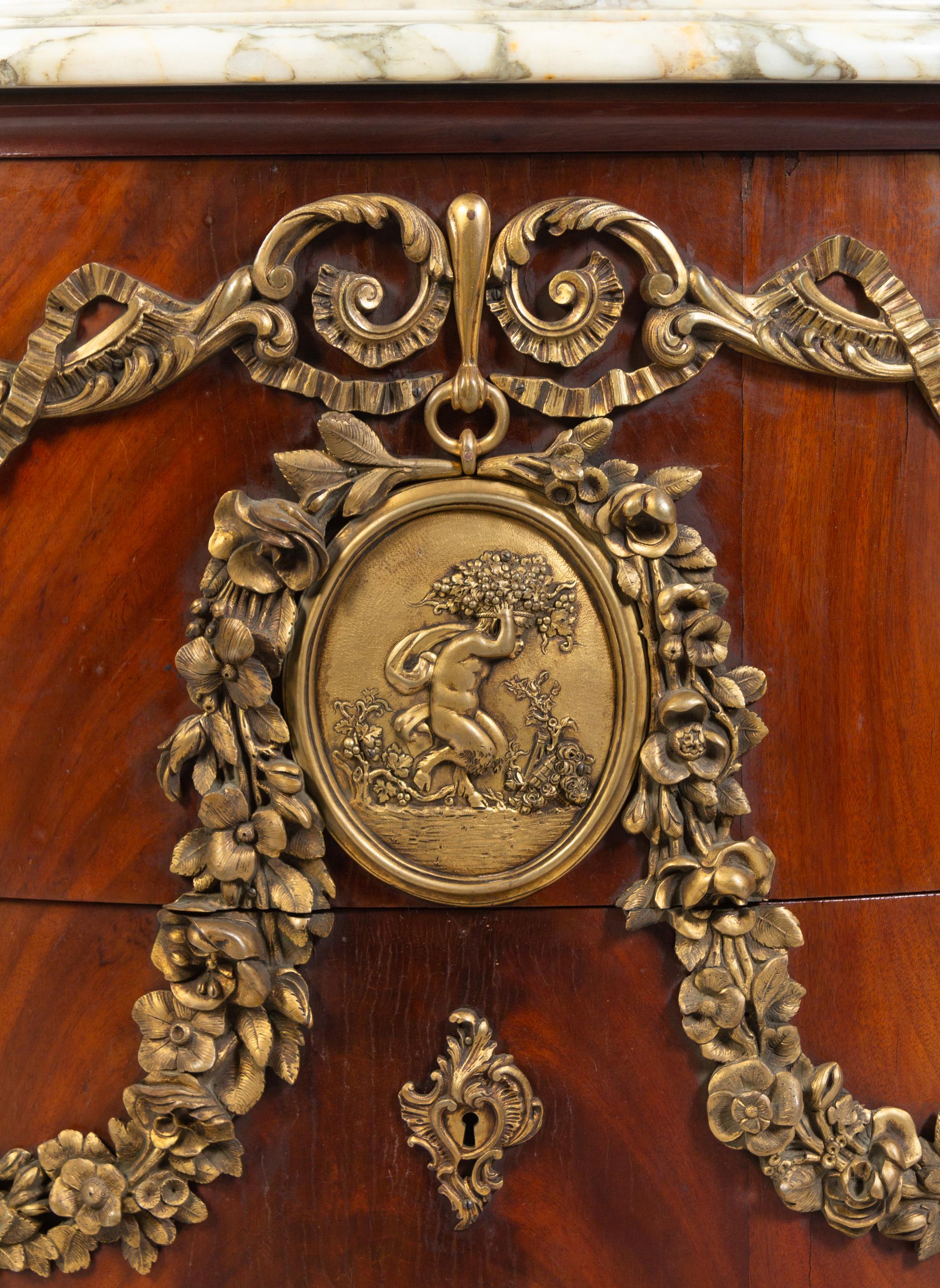 A Louis XV Style Gilt Metal Mounted Figured Walnut Commode