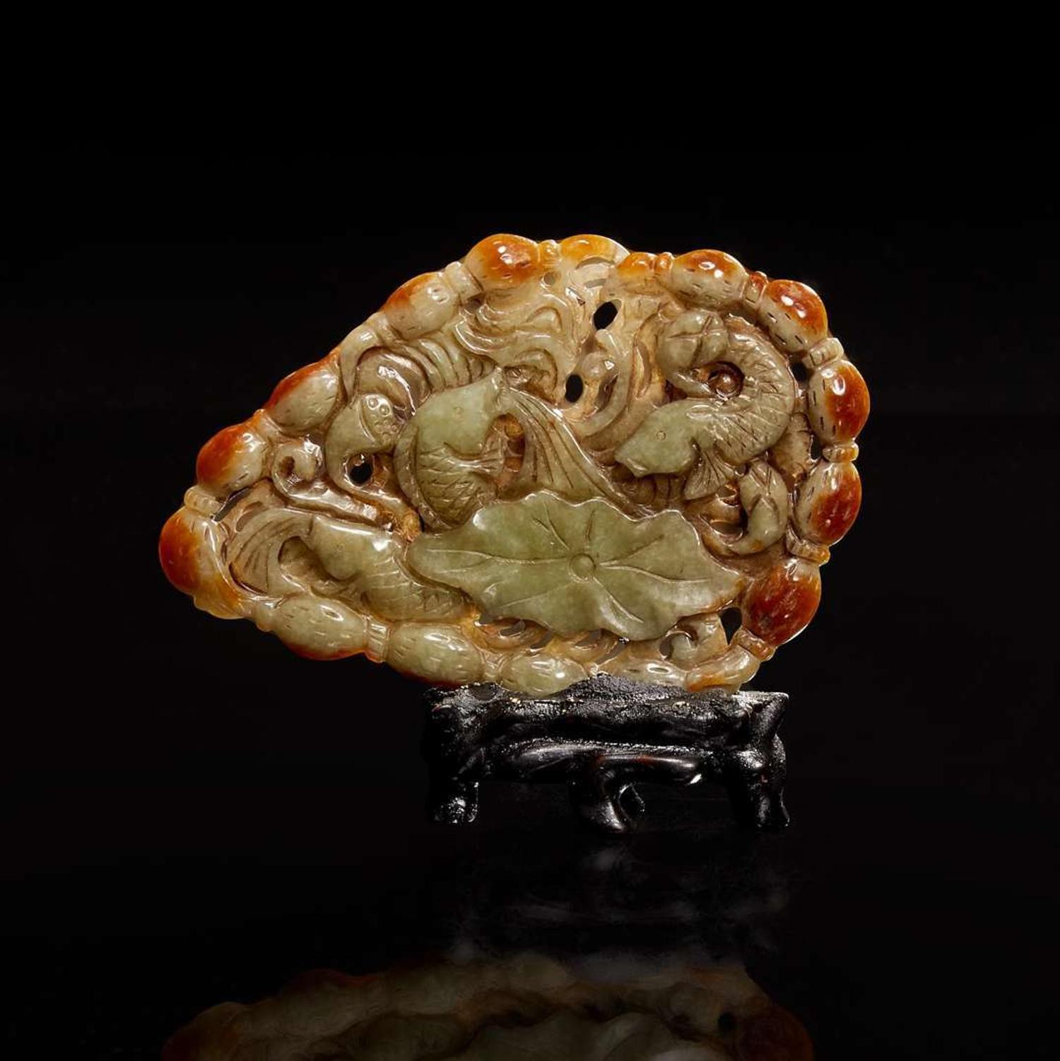 A Chinese carved celadon-grey and russet jade plaque 玉牌一件