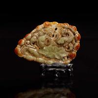 A Chinese carved celadon-grey and russet jade plaque 玉牌一件