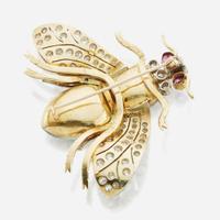 An emerald, diamond, and ruby bicolor gold brooch