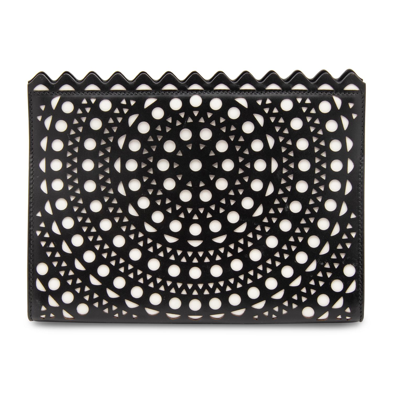 ALAÏA, LASER-CUT LEATHER CLUTCH
