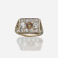 A colored diamond, diamond, and fourteen karat white gold ring
