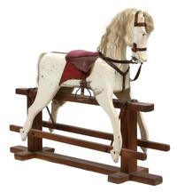 An American Primitive Painted Rocking Horse Height 46 x width 54 x depth 12 inches. — 19TH CENTURY