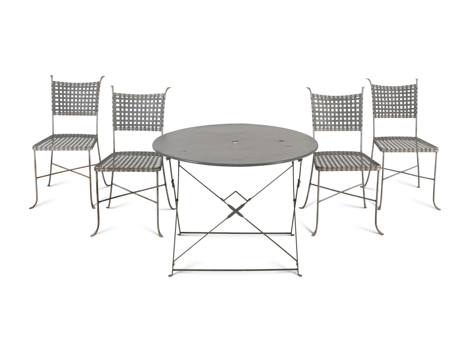 A Painted Metal Garden Table and a Set of Four Woven Metal Garden Chairs