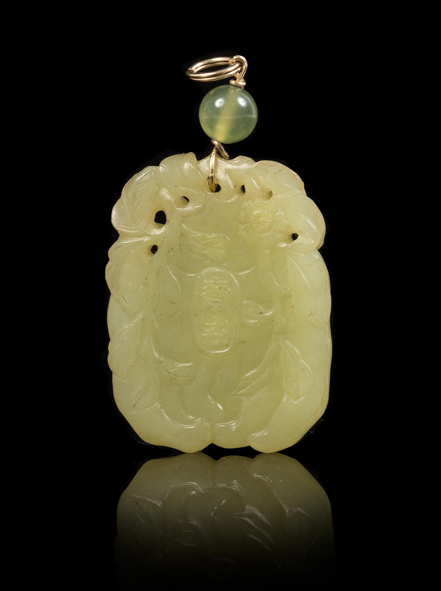 A Yellow Jade Pendant Height of pendant 1 3/4 inches.