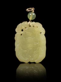 A Yellow Jade Pendant Height of pendant 1 3/4 inches.