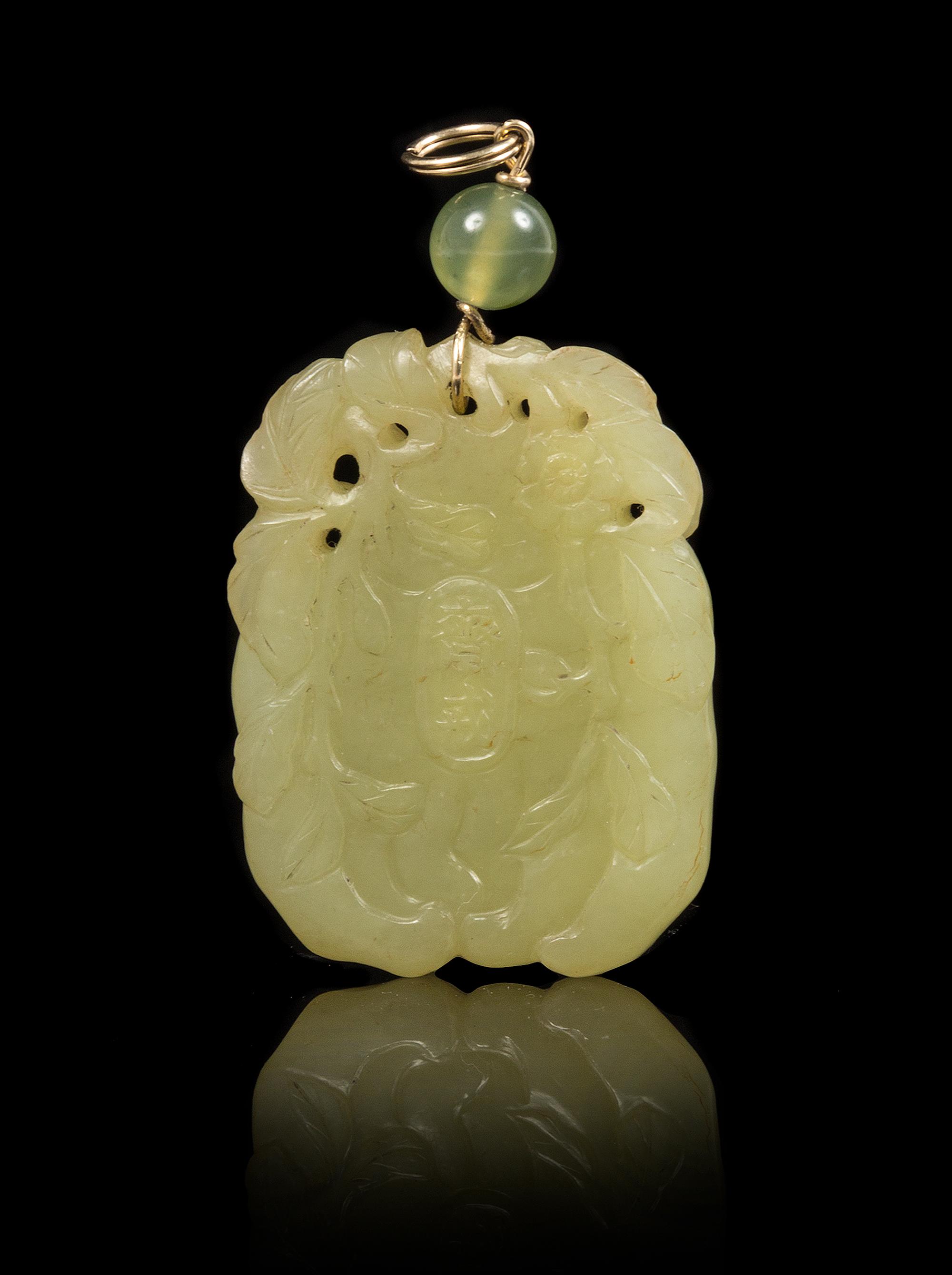 A Yellow Jade Pendant Height of pendant 1 3/4 inches.