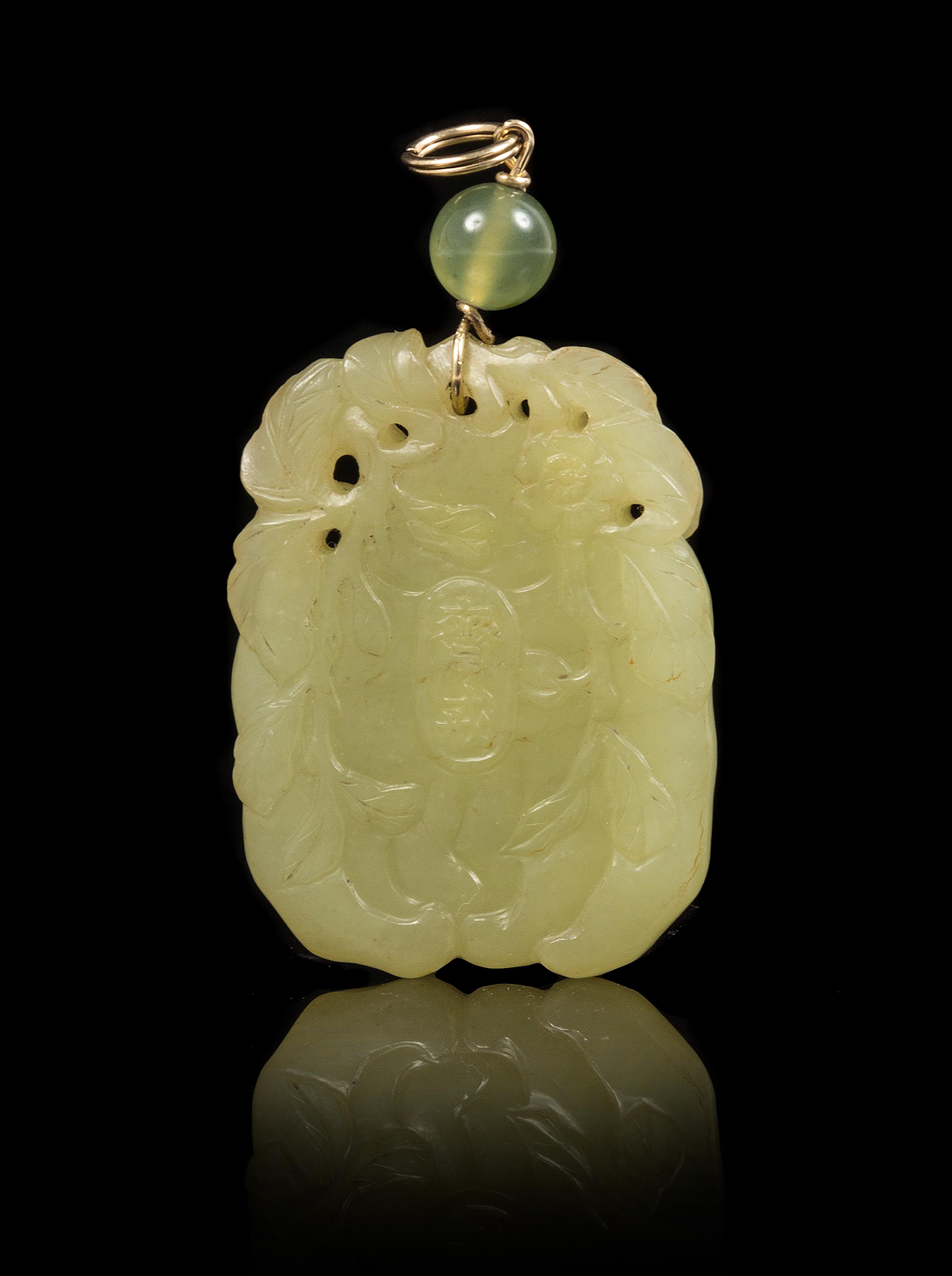 A Yellow Jade Pendant Height of pendant 1 3/4 inches.