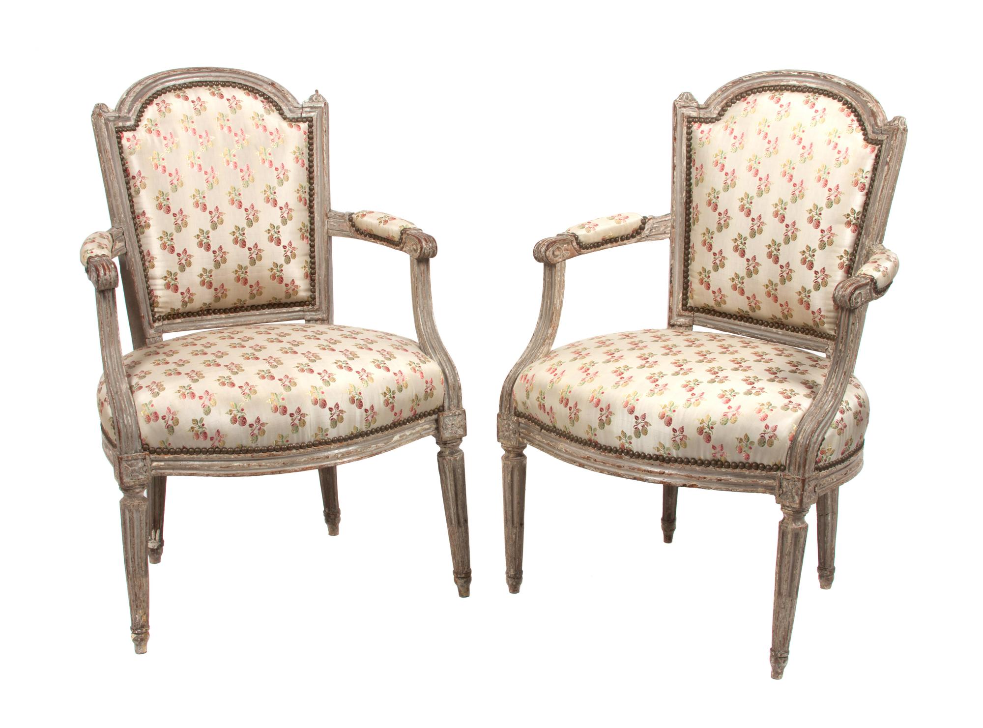 A Pair of Louis XVI Style Cream Painted Fauteuil Height 24 inches.