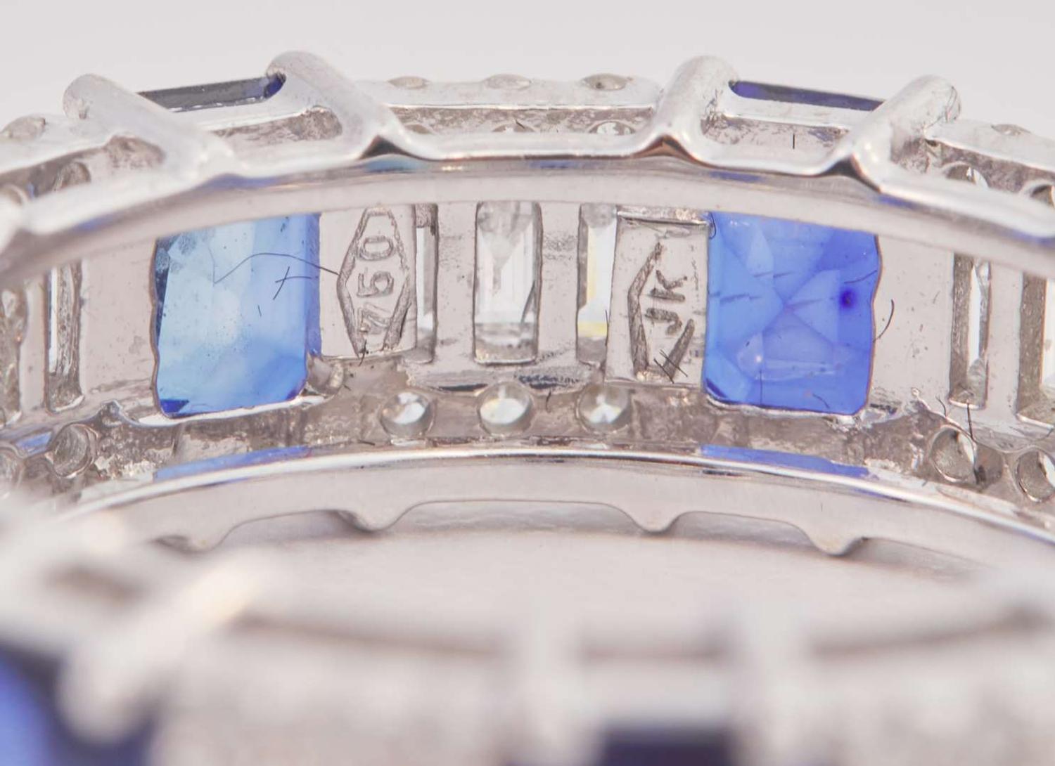 An 18K White Gold, Sapphire, and Diamond Eternity Band