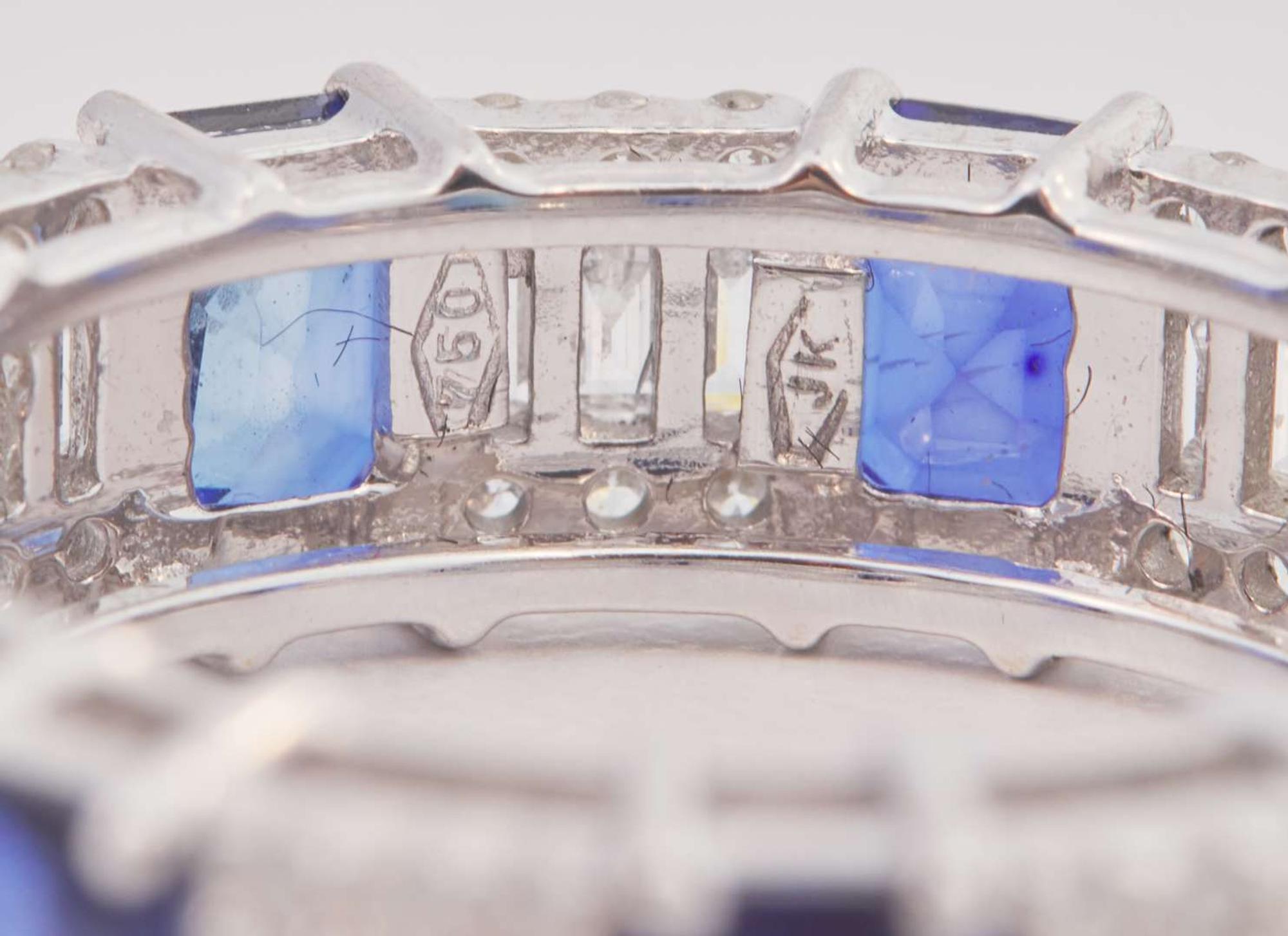 An 18K White Gold, Sapphire, and Diamond Eternity Band