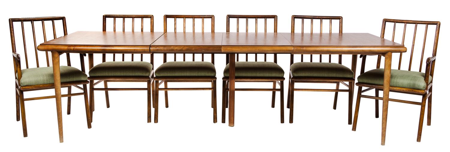 A Walnut Extension Dining Set, attributed to Robsjohn Gibbings for Widdicomb Height of chairs 35 inches.