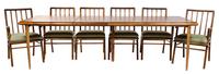 A Walnut Extension Dining Set, attributed to Robsjohn Gibbings for Widdicomb Height of chairs 35 inches.
