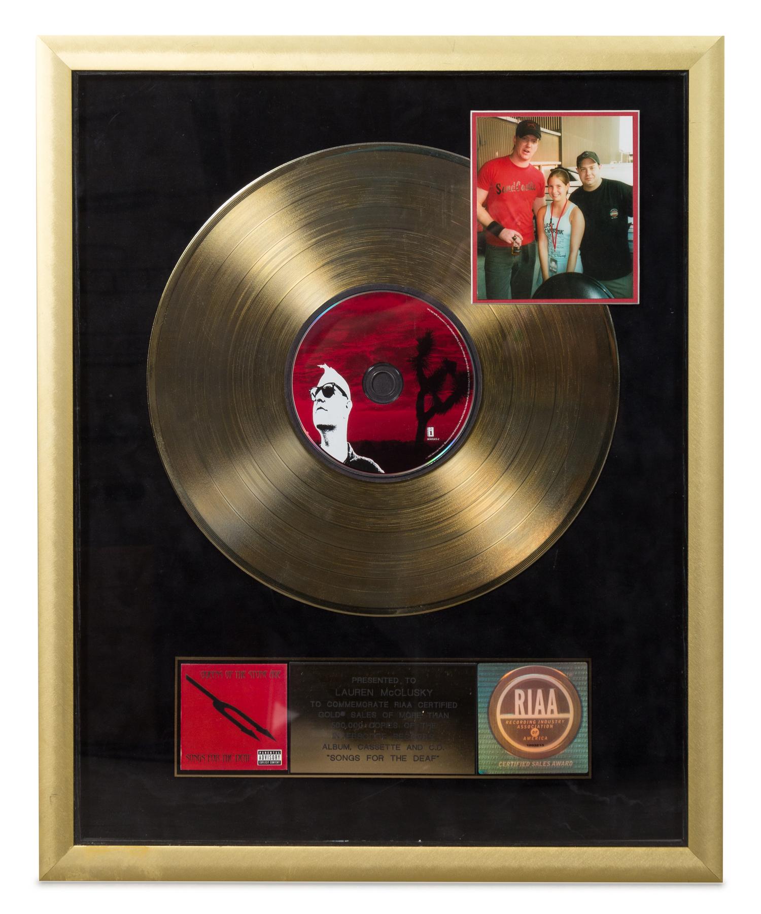 A Queens of the Stone Age: Songs for the Deaf RIAA Certified Gold Presentation Album 21 1/4 x 17 1/2 inches.