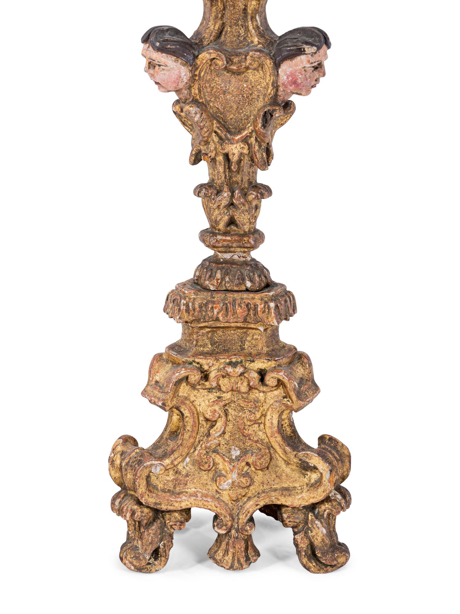A Pair of Italian Baroque Gilt and Polychromed Pricket Sticks