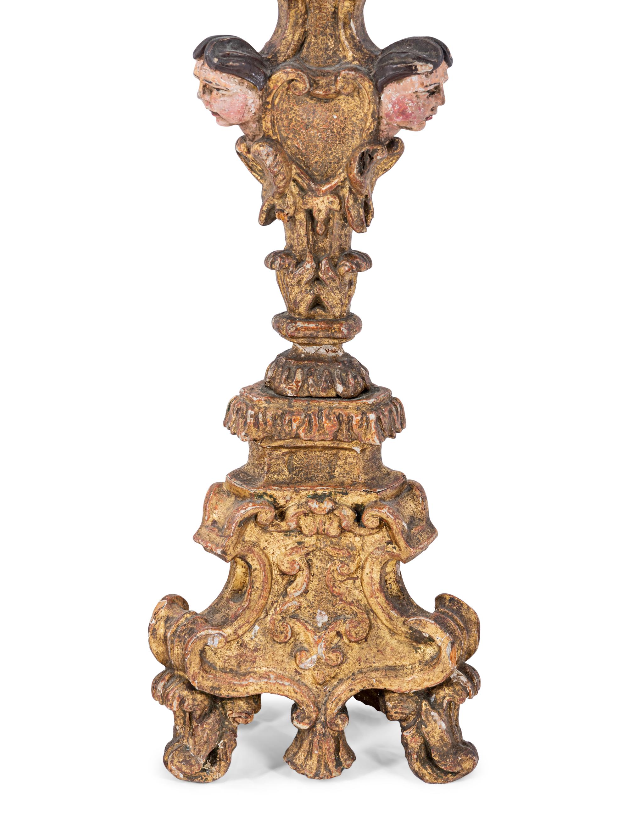 A Pair of Italian Baroque Gilt and Polychromed Pricket Sticks