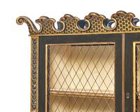 A Continental Ebonized and Parcel Gilt Bookcase