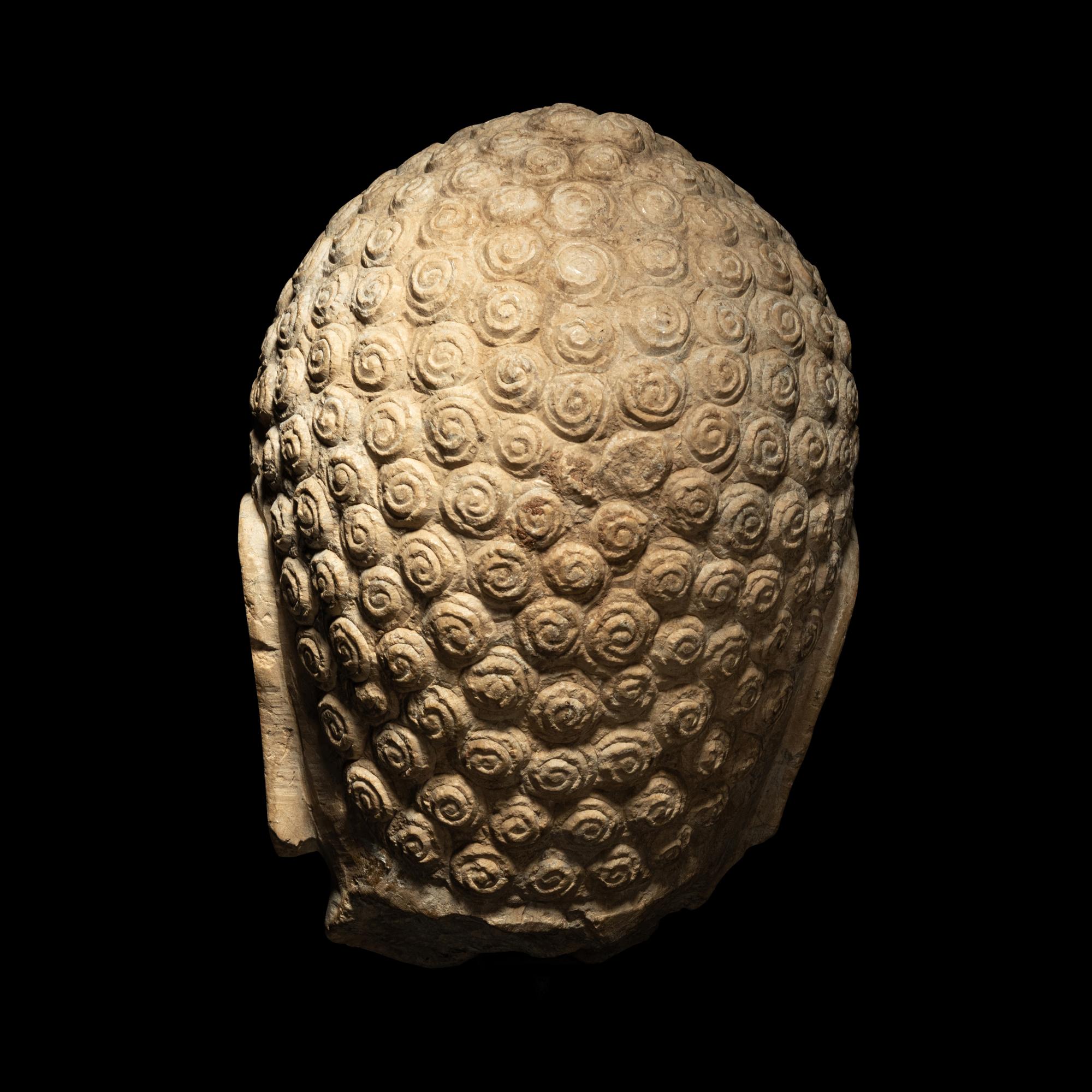 A Carved Stone Head of Buddha