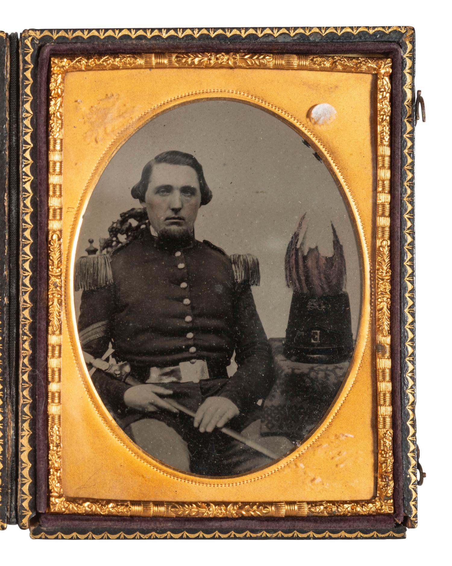 [MILITIA]. Quarter plate ambrotype of a militia sergeant with sword and plumed shako.