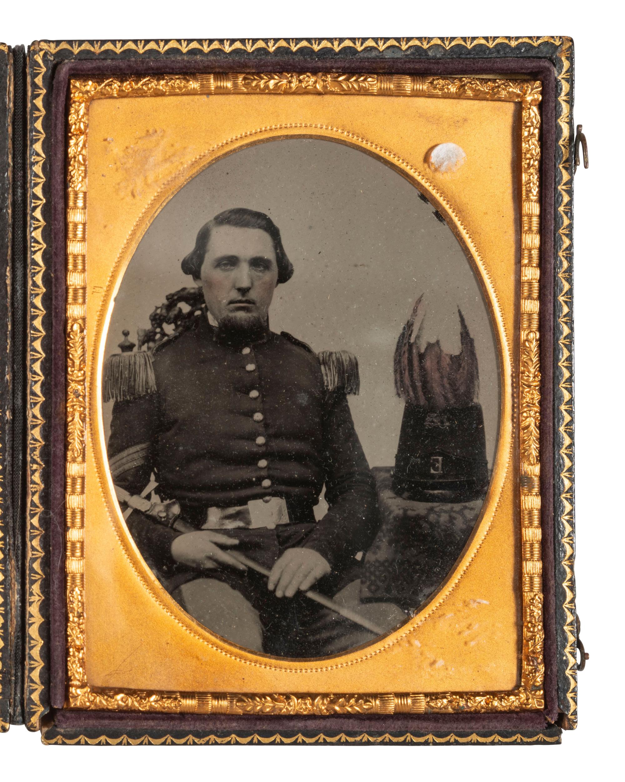 [MILITIA]. Quarter plate ambrotype of a militia sergeant with sword and plumed shako.
