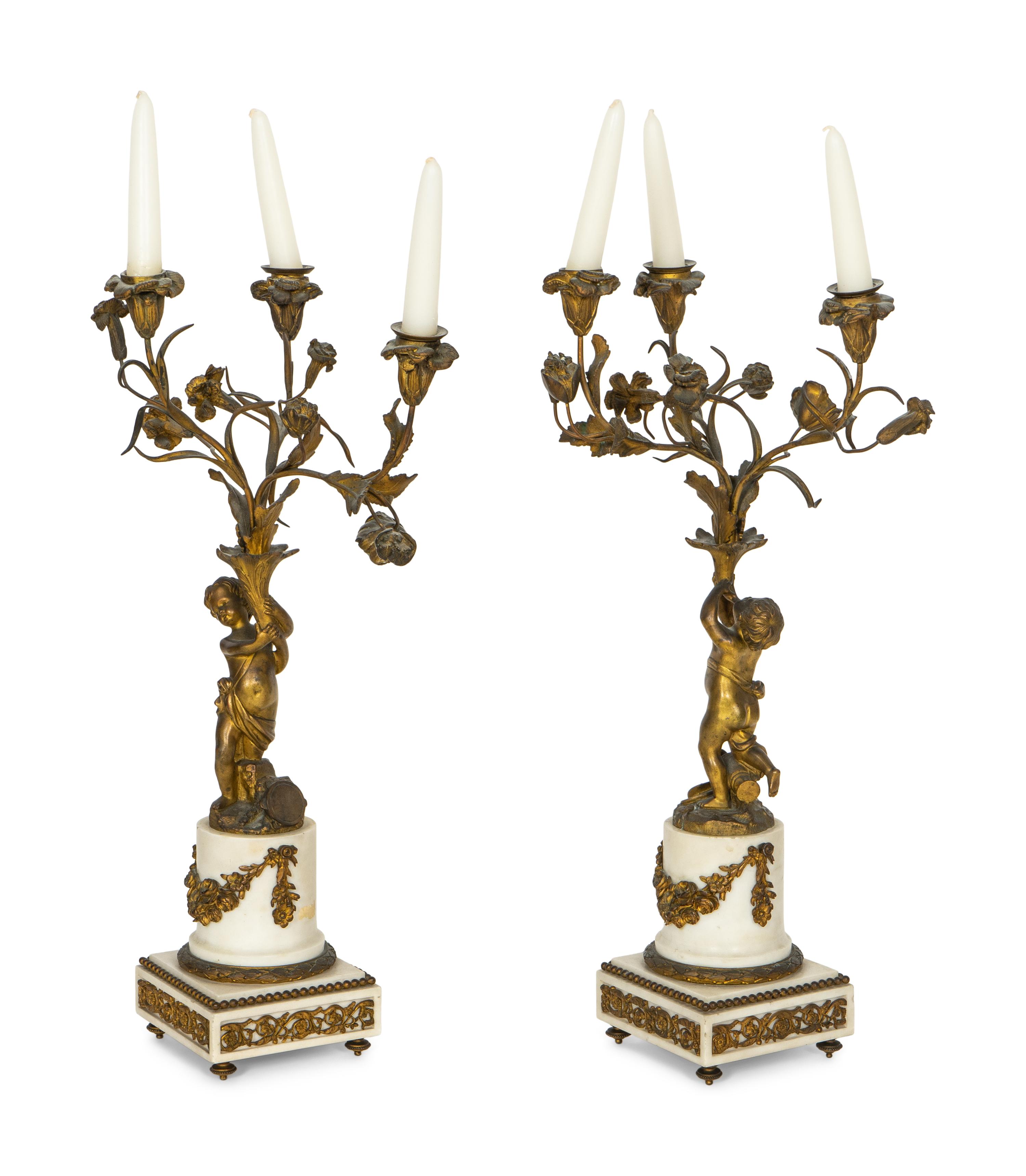 A Pair of French Gilt Bronze and Alabaster Three-Light Candelabra