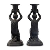 A Pair of Grand Tour Patinated Metal Figural Candlesticks
