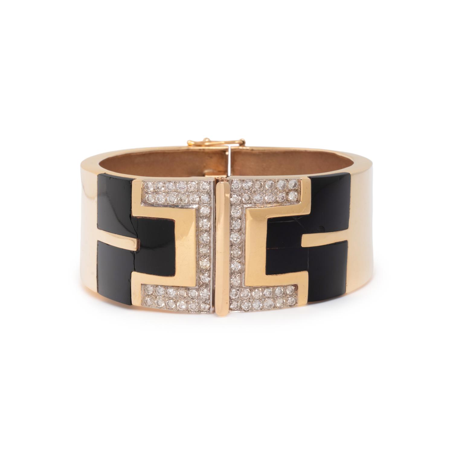 YELLOW GOLD, ONYX, AND DIAMOND HINGED BANGLE BRACELET