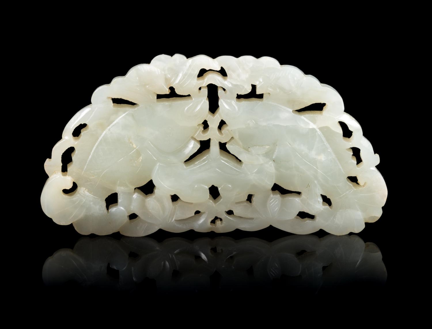 An Openwork Pale Celadon Jade 'Fish' Pendant Length 3 3/4 inches. — 19TH CENTURY