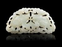 An Openwork Pale Celadon Jade 'Fish' Pendant Length 3 3/4 inches. — 19TH CENTURY