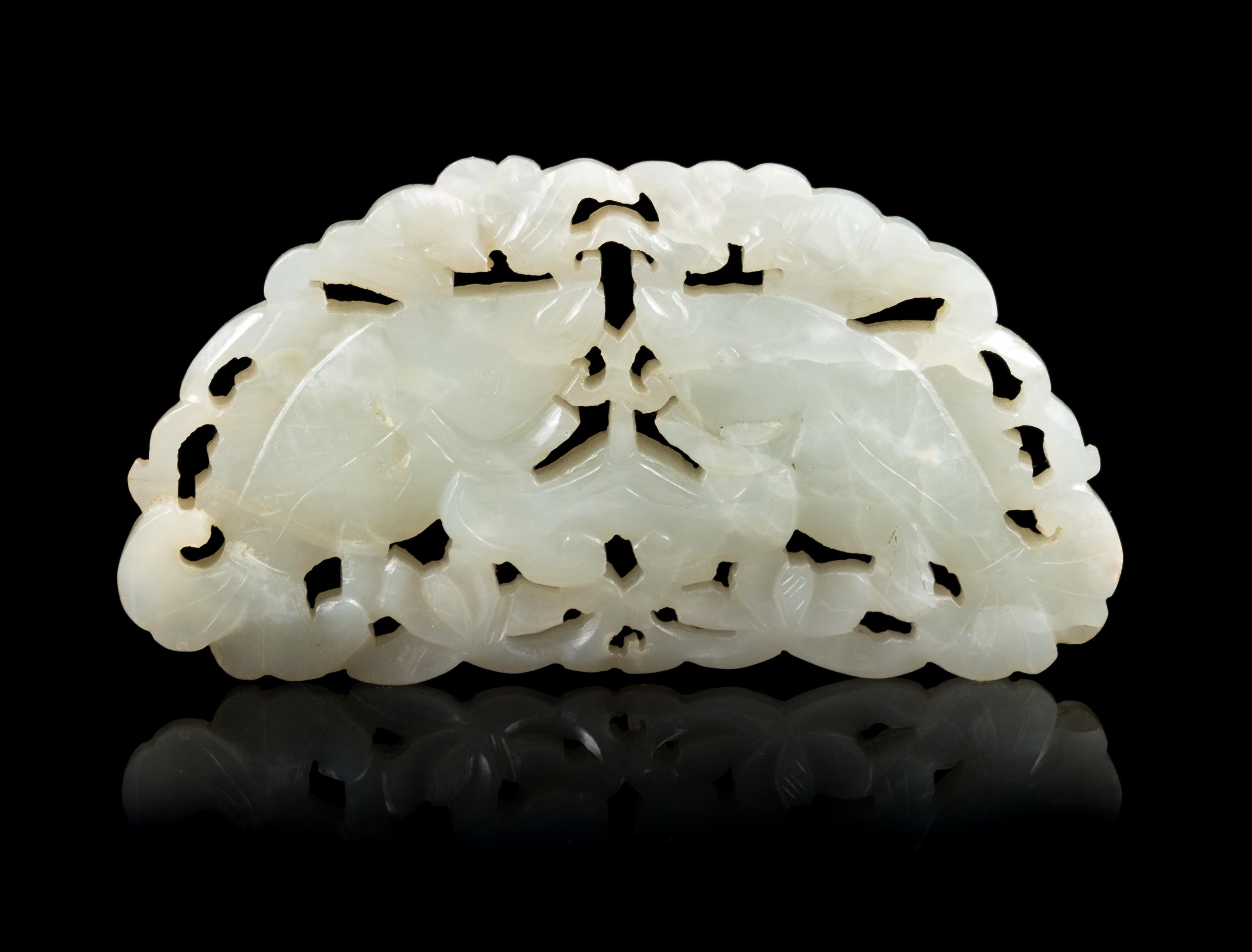 An Openwork Pale Celadon Jade 'Fish' Pendant Length 3 3/4 inches. — 19TH CENTURY