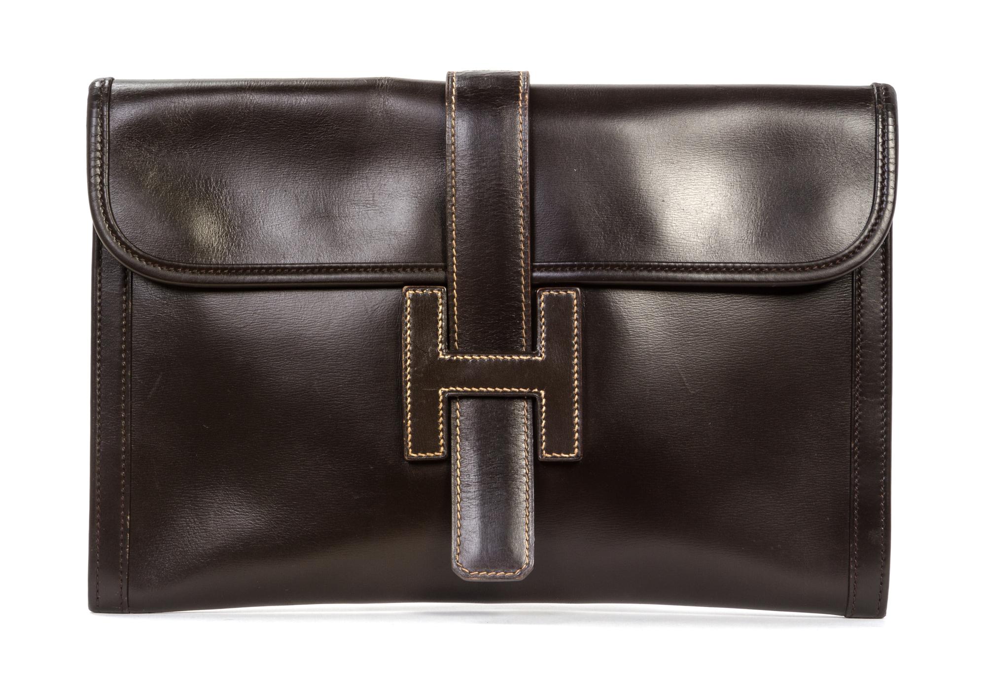 An Hermes Brown Leather Jige PM Clutch, 11 1/4 x 7 1/2 x 1/4 inches.