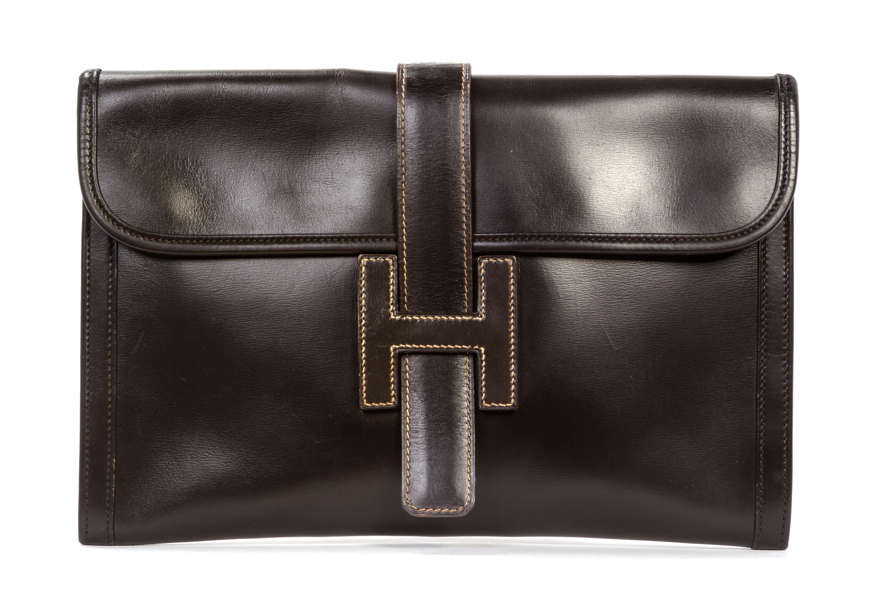 An Hermes Brown Leather Jige PM Clutch, 11 1/4 x 7 1/2 x 1/4 inches.