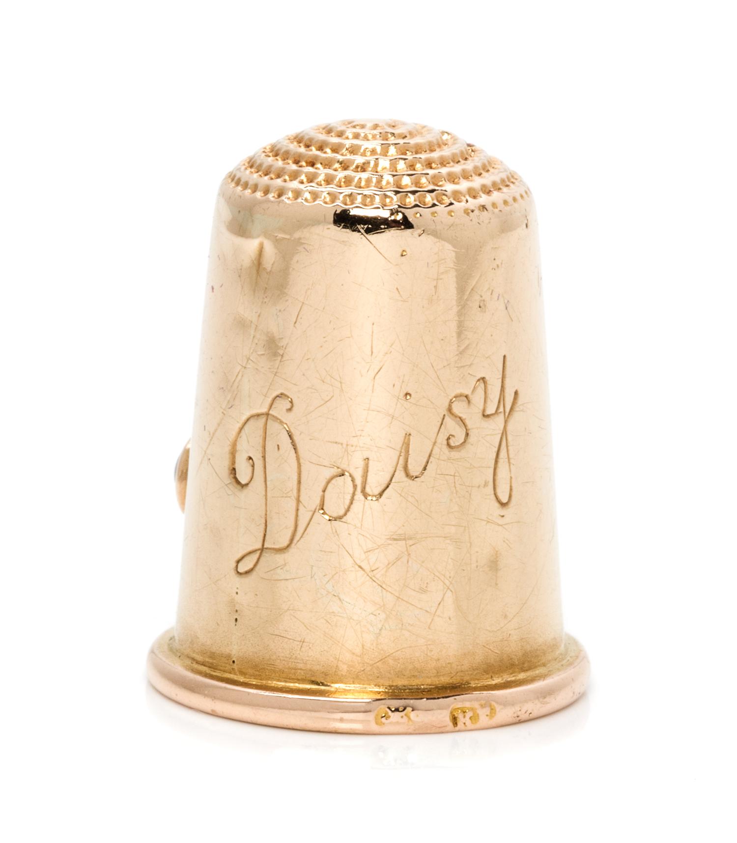 A Russian Gold, Diamond and Ruby Thimble, Maker's Mark of Carl Faberge, St. Petersburg, Late 19th/Early 20th Century, the knurled top a