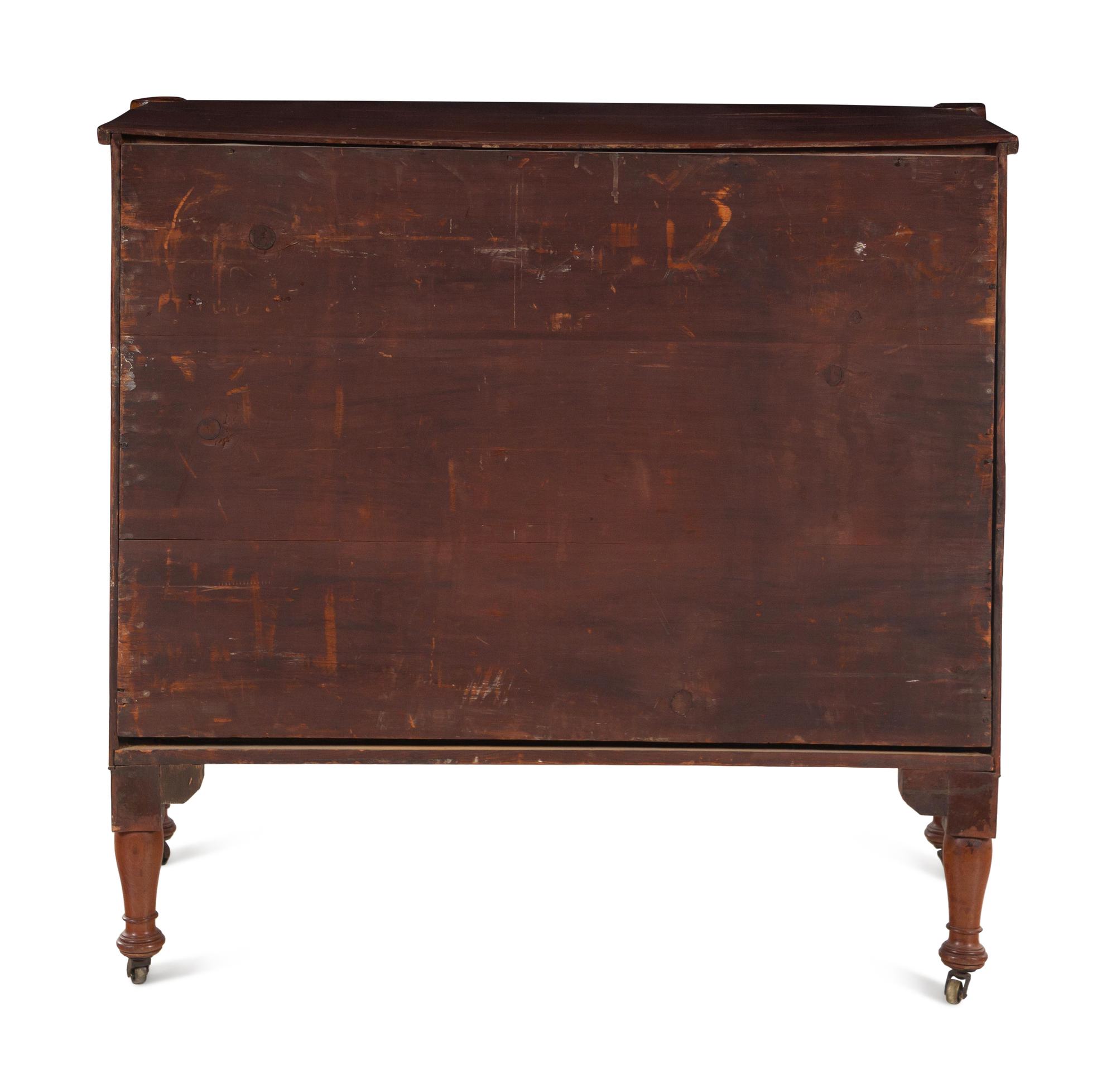 A Federal Carved and Figured Mahogany Bow-Front Chest of Drawers