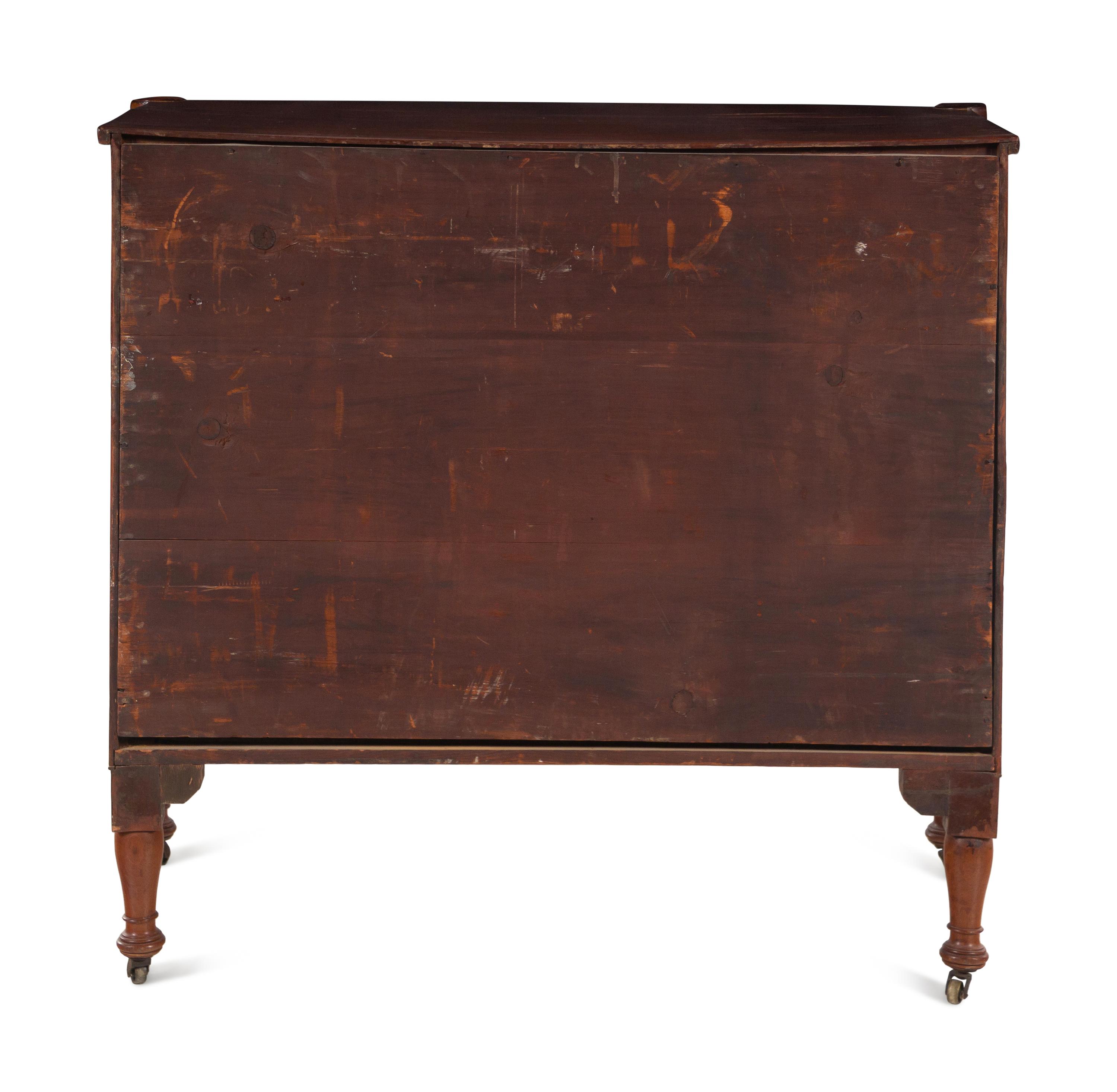 A Federal Carved and Figured Mahogany Bow-Front Chest of Drawers