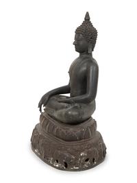 A Cambodian Bronze Figure of Seated Deity on Conforming Base