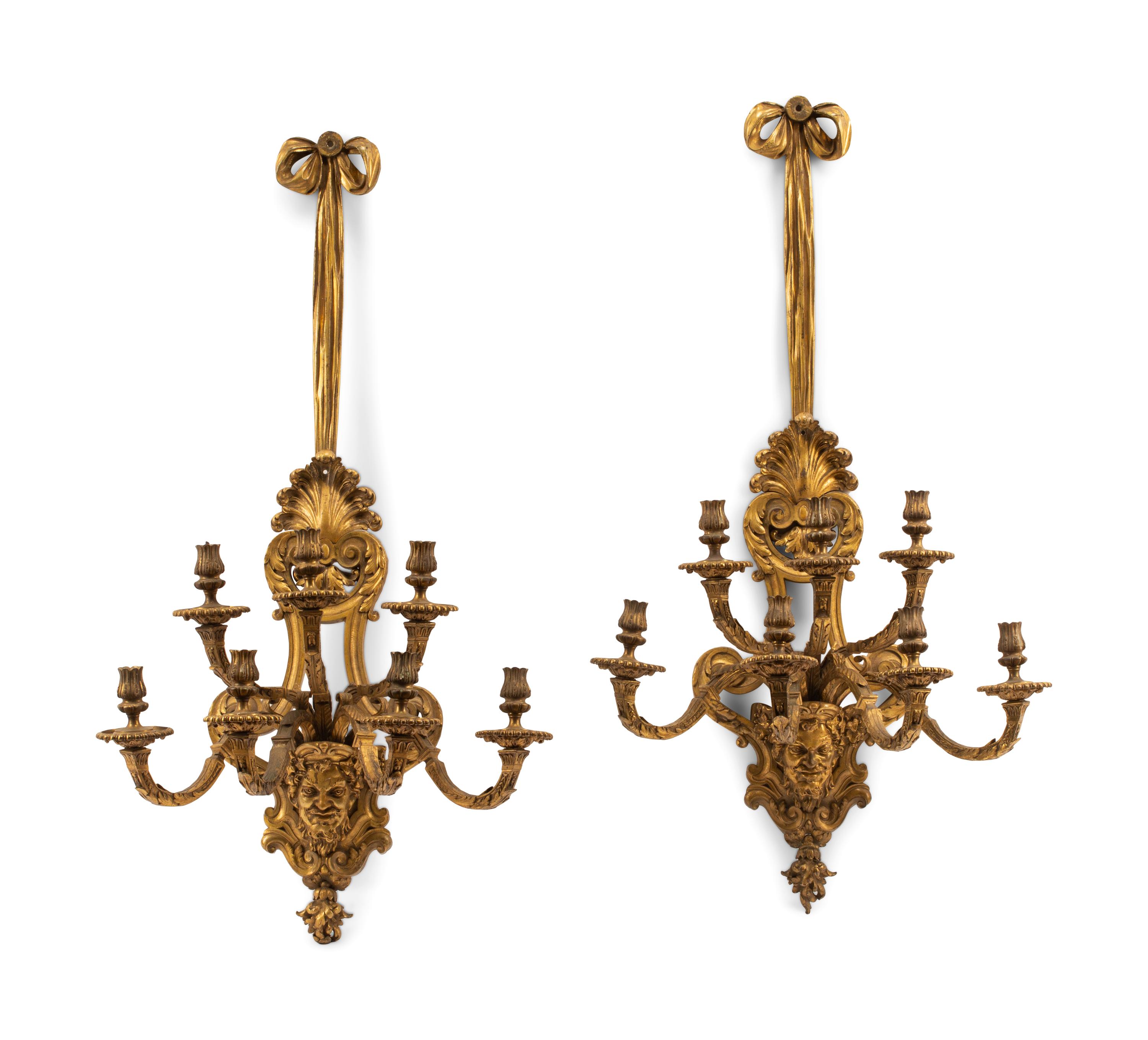 A Pair of Régence Style Gilt Bronze Seven-Light Sconces