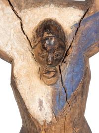 A Yaka Post, with forked finial painted blue and white, a mask in relief at the center