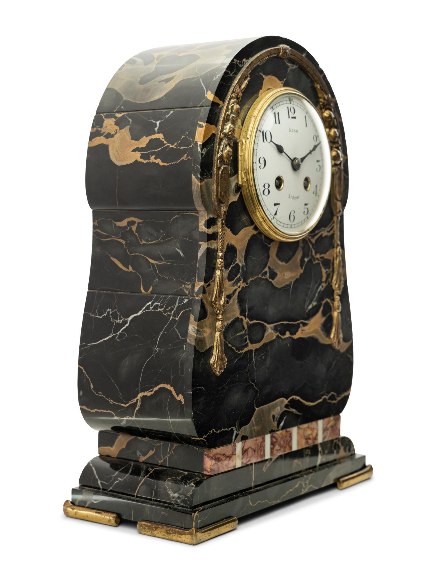 A Continental Gilt Bronze Mounted Marble Mantel Clock