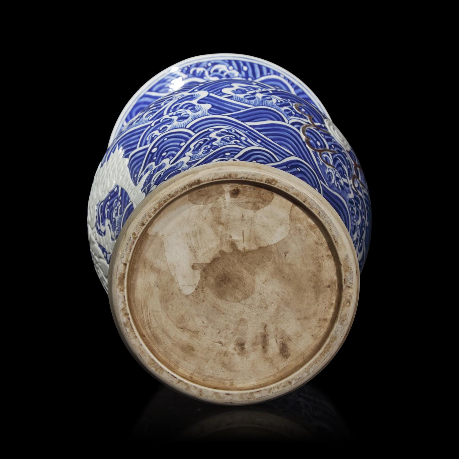 A Large Japanese Carved Blue and White and Red Porcelain 'Kylin on Waves' Vase, Meiji Period 日本明治時期 青花麒麟紋大瓶