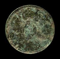 A Greek Bronze Mirror with the Head of a Woman