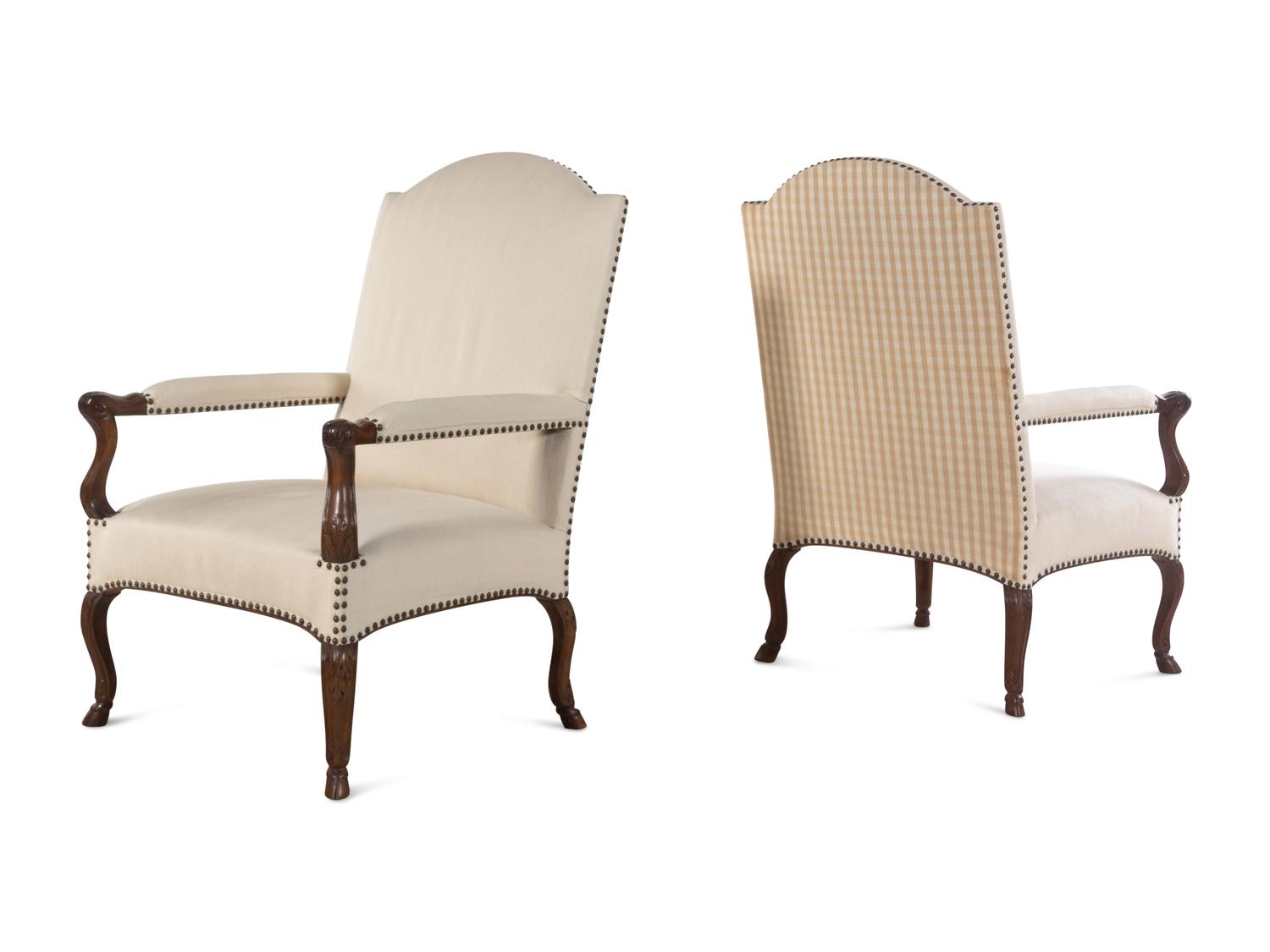 A Set of Four Régence Style Carved Walnut Library Chairs